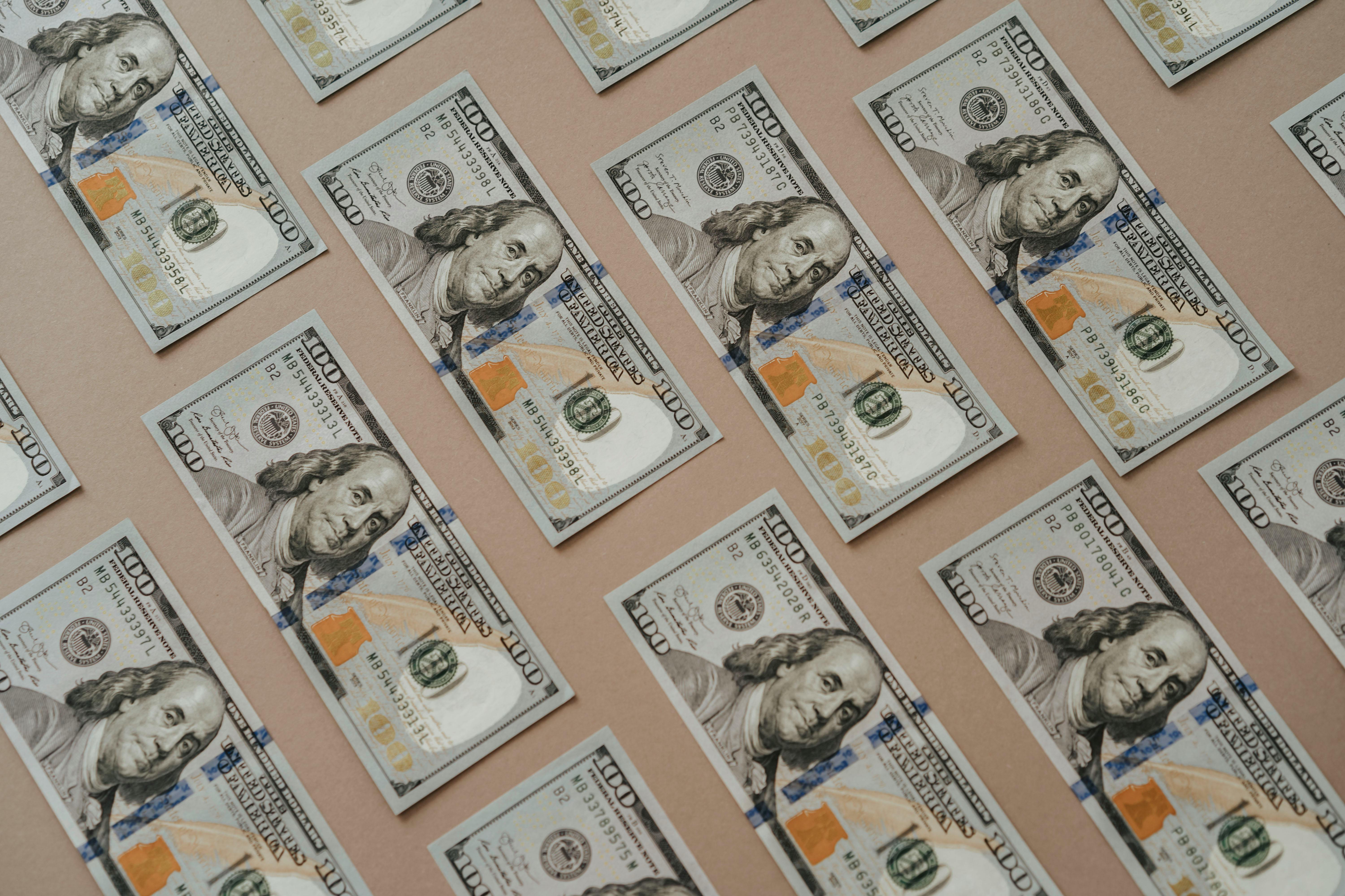 U.S. one-hundred-dollar bills laid out flat