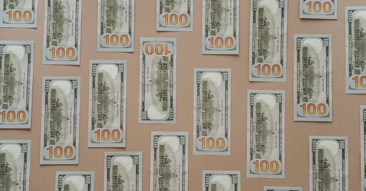 Photo by olia danilevich Flatlay of hundred dollar bills arranged on a surface representing wealth and finance.