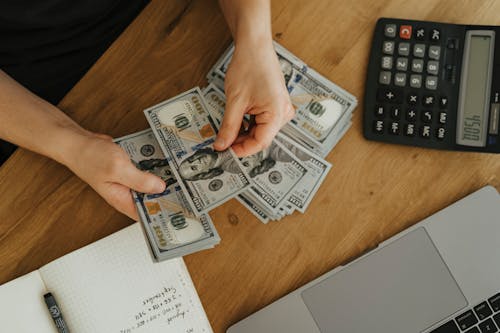Free A Person Holding Money Stock Photo