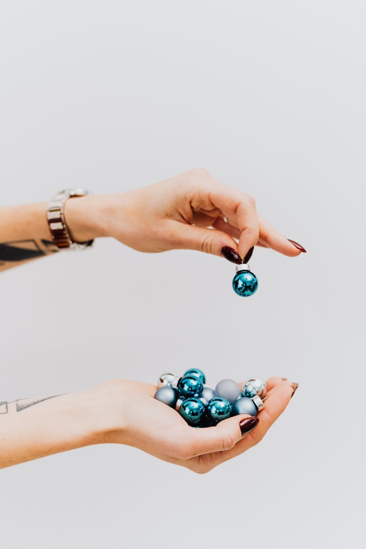 Woman Holding Blue Baubles