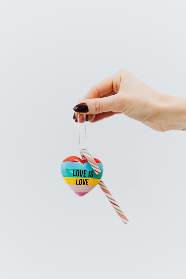 Person Holding Striped Heart