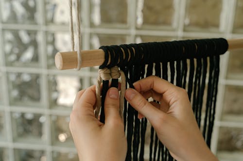 Free Person Weaving the Yarns Stock Photo