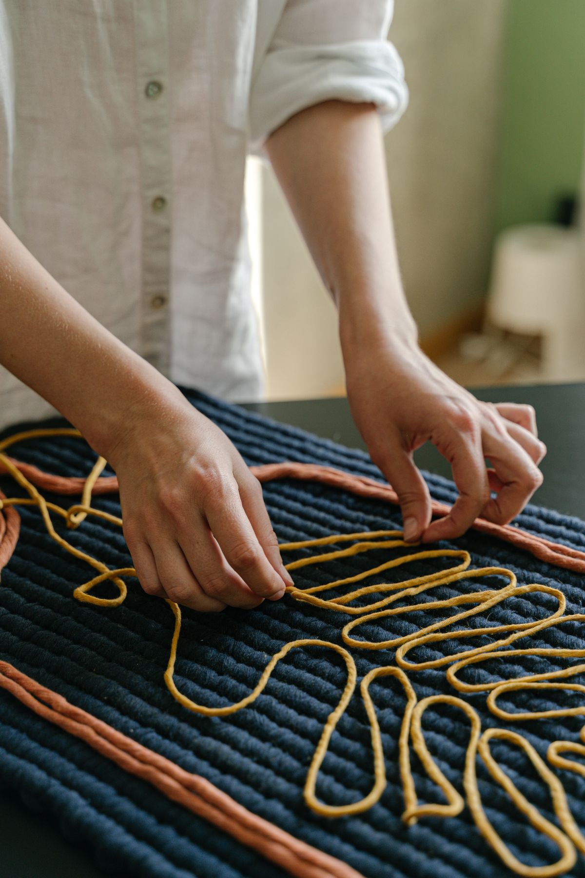 Cotton rope craft hands working on macrame crafts