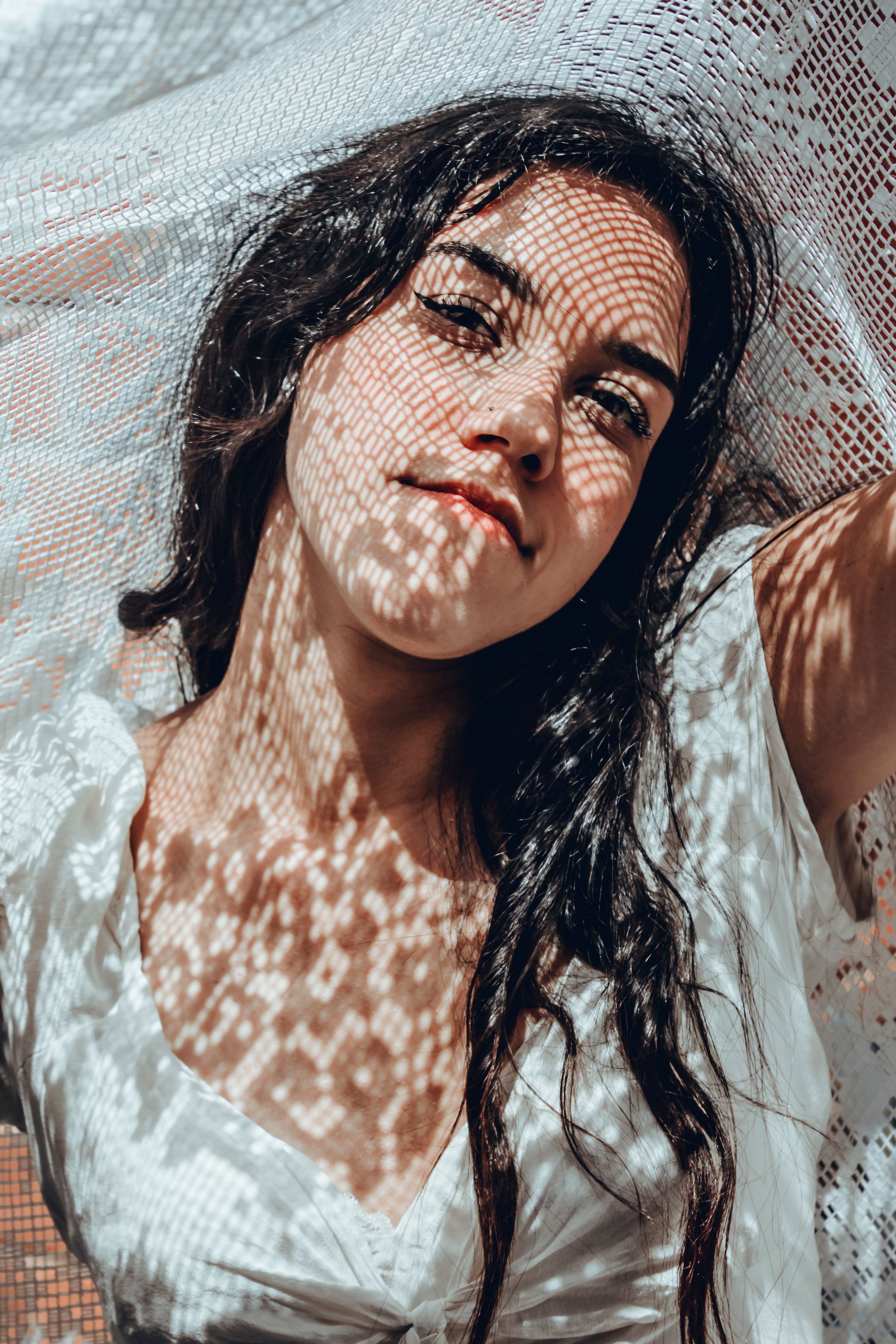 A Woman in White Shirt Looking at the Camera · Free Stock Photo
