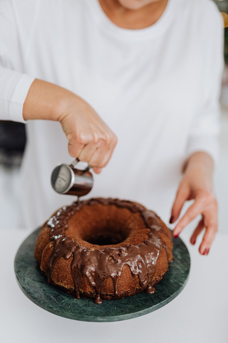 Woman Decorating Traditional Christmas Cake