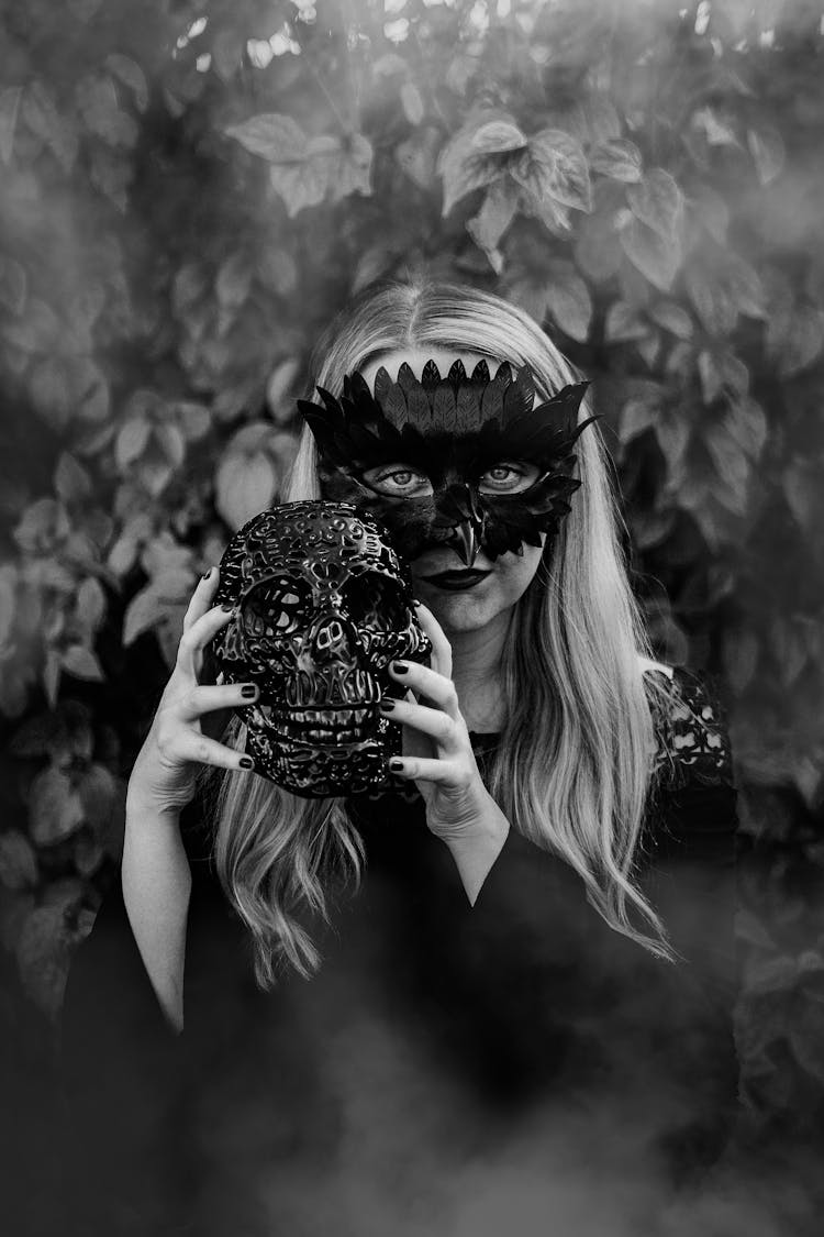 Woman In Mask Holding Skull