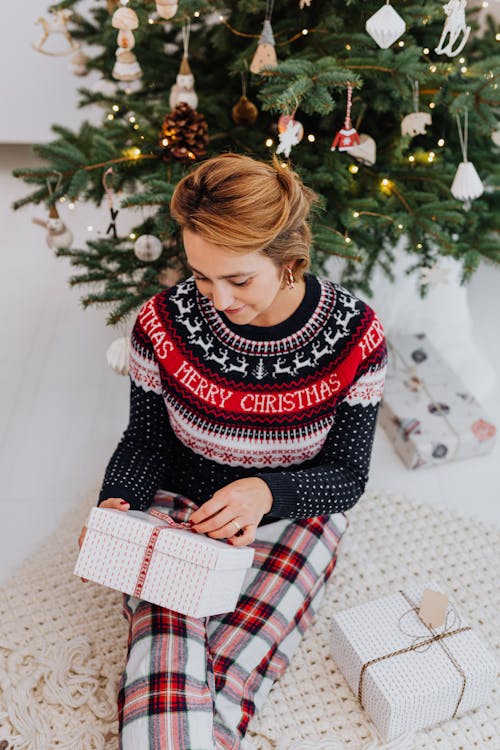 Free Girl in Black and White Sweater Reading Book Stock Photo