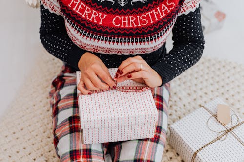 Free A Woman Wrapping a Gift Stock Photo