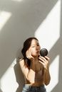 A Woman Using a Face Powder