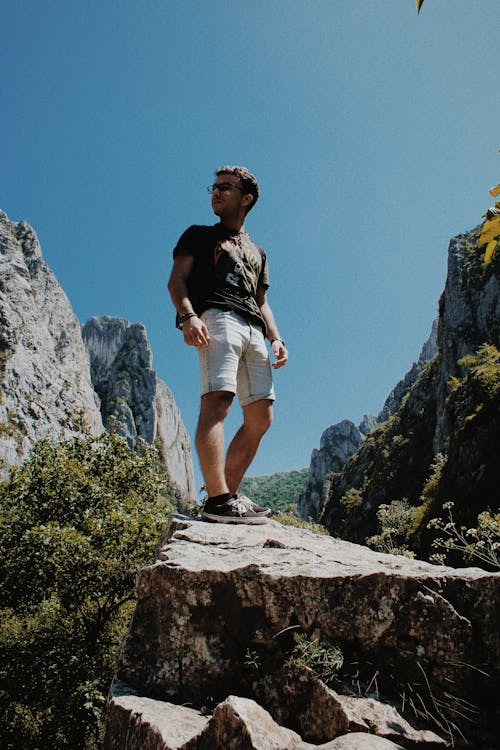 
A Man Standing on a Rock