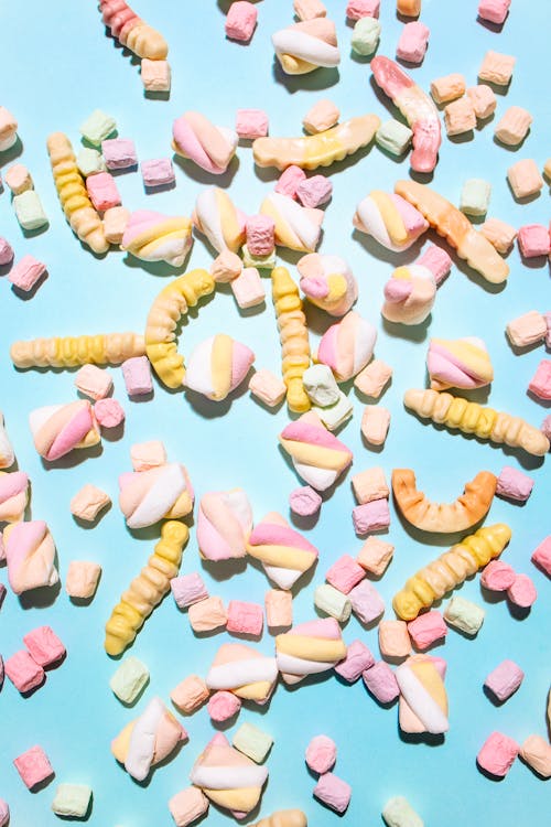 Free Colorful Sweets and Marshmallows on Blue Back Stock Photo