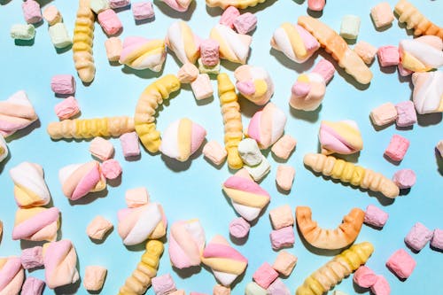 Close-Up Shot of Sweet Candies on Light Blue Background