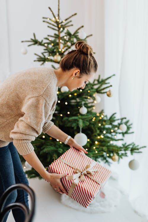 A Woman Holding a Christmas Present