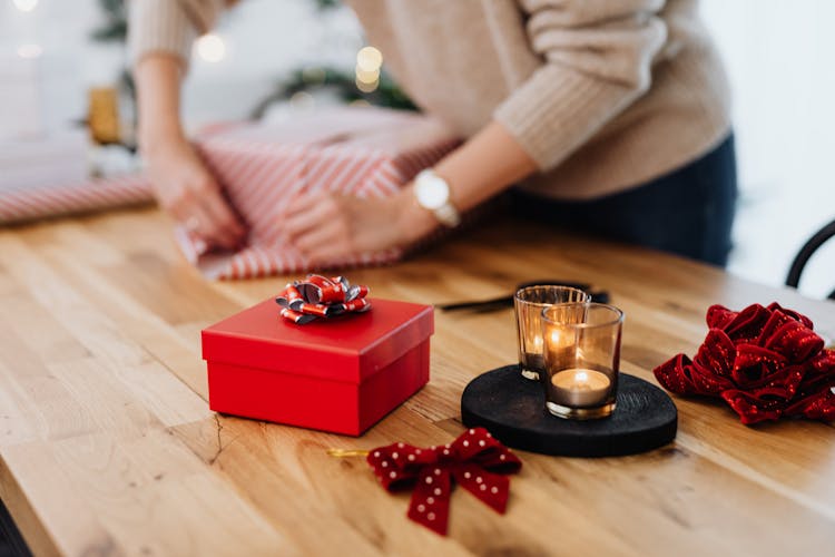 Person Wrapping Christmas Presents