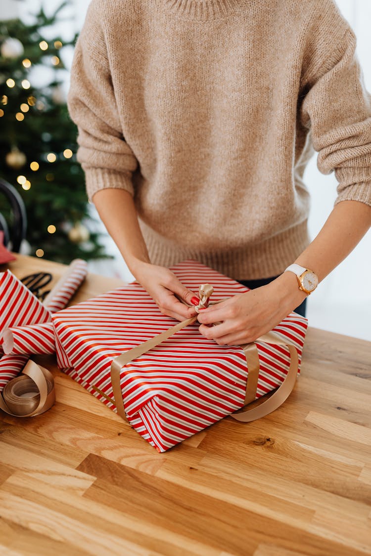 Woman Wrapping Gift Box