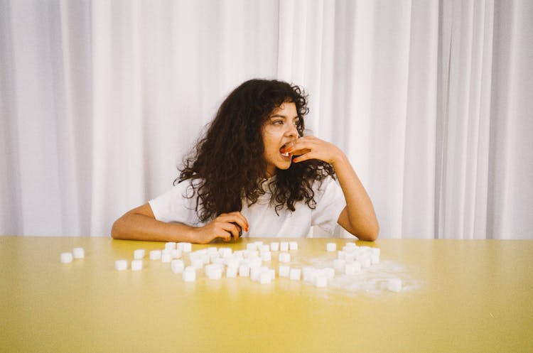 Woman Eating Sugar Cubes