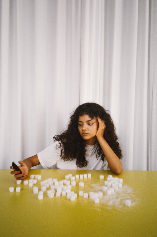 A Woman Sitting at the Table