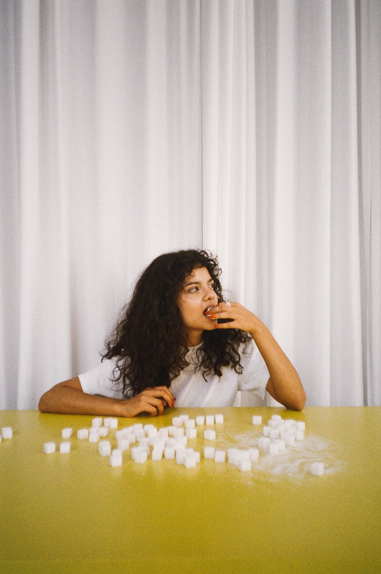 Woman Eating Sugar Cubes