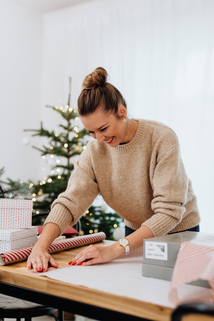 Portrait Of Woman Wrapping Christmas Gifts