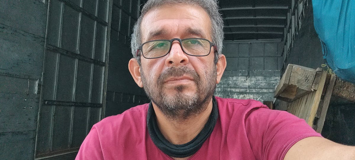 Tofu being cubed on a cutting board