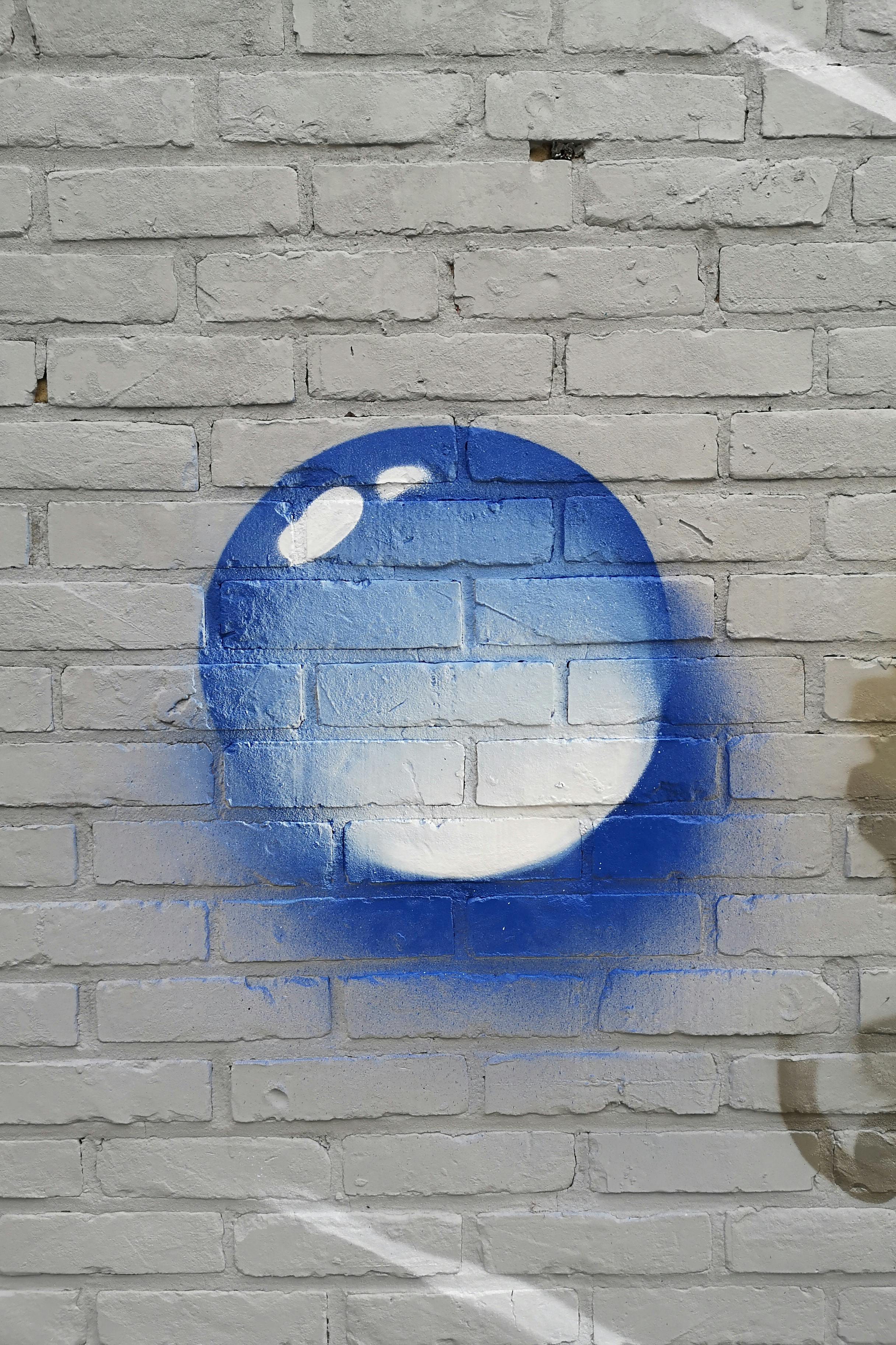 Two salmon and vegetable bowls arranged on a table with napkins and cutlery