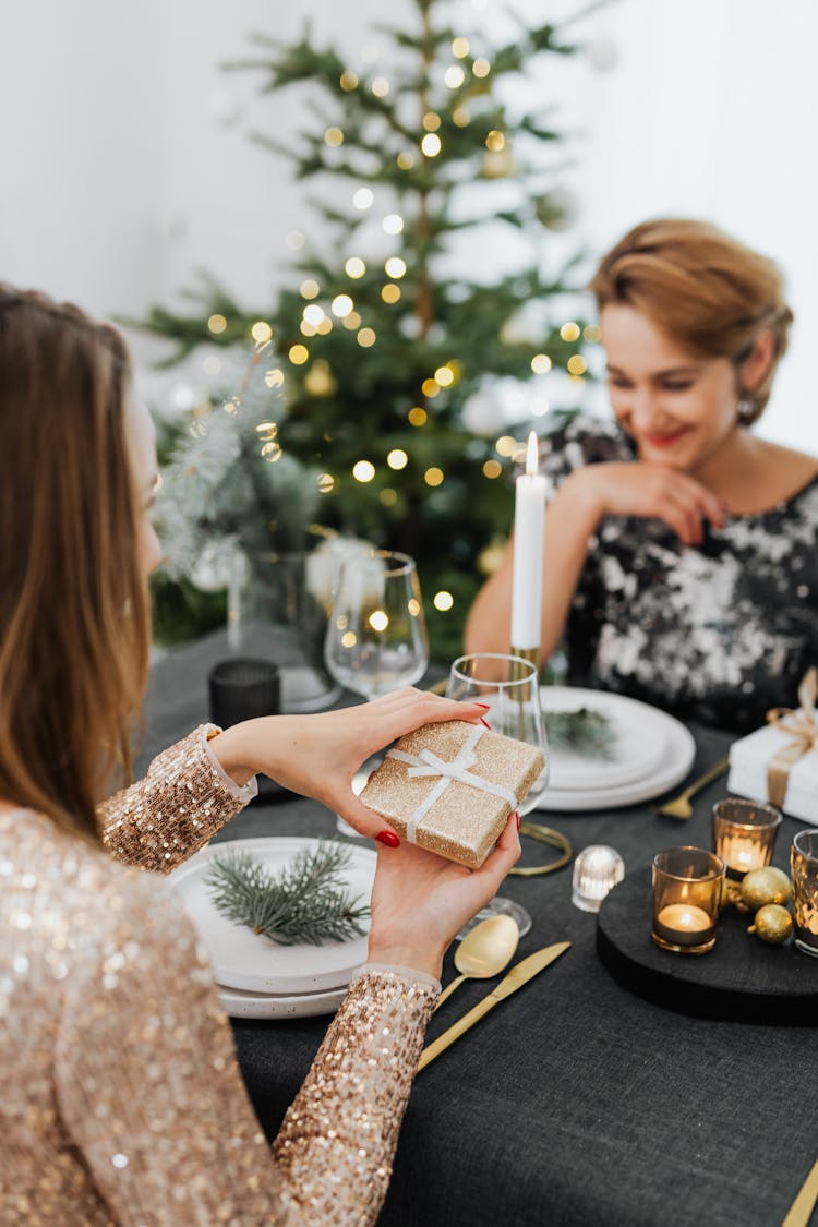 Woman Opening A Gift Box