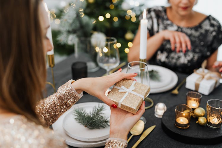 Woman Opening A Gift Box
