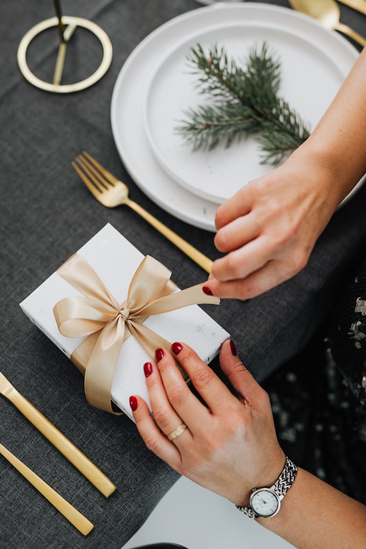 Person Opening A Gift Box