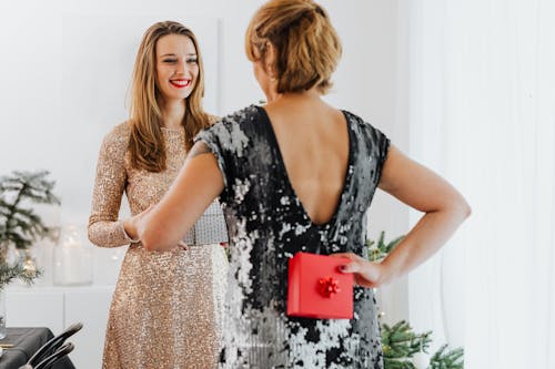 Friends Exchanging Christmas Gifts