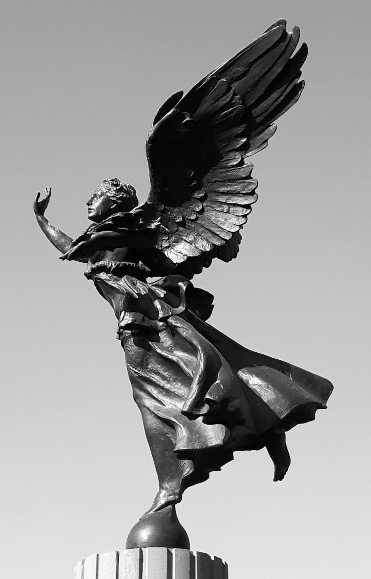 Bronze Statue Against Clear Sky