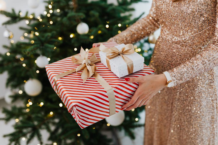 Close-up Of Woman Holding Christmas Presents