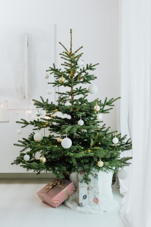 Green Christmas Tree With White Baubles