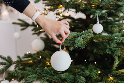 Person Holding White Christmas Bauble