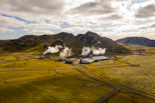 Hellisheidi Geothermal Power Plant on Grass Field Under a Cloudy Sky