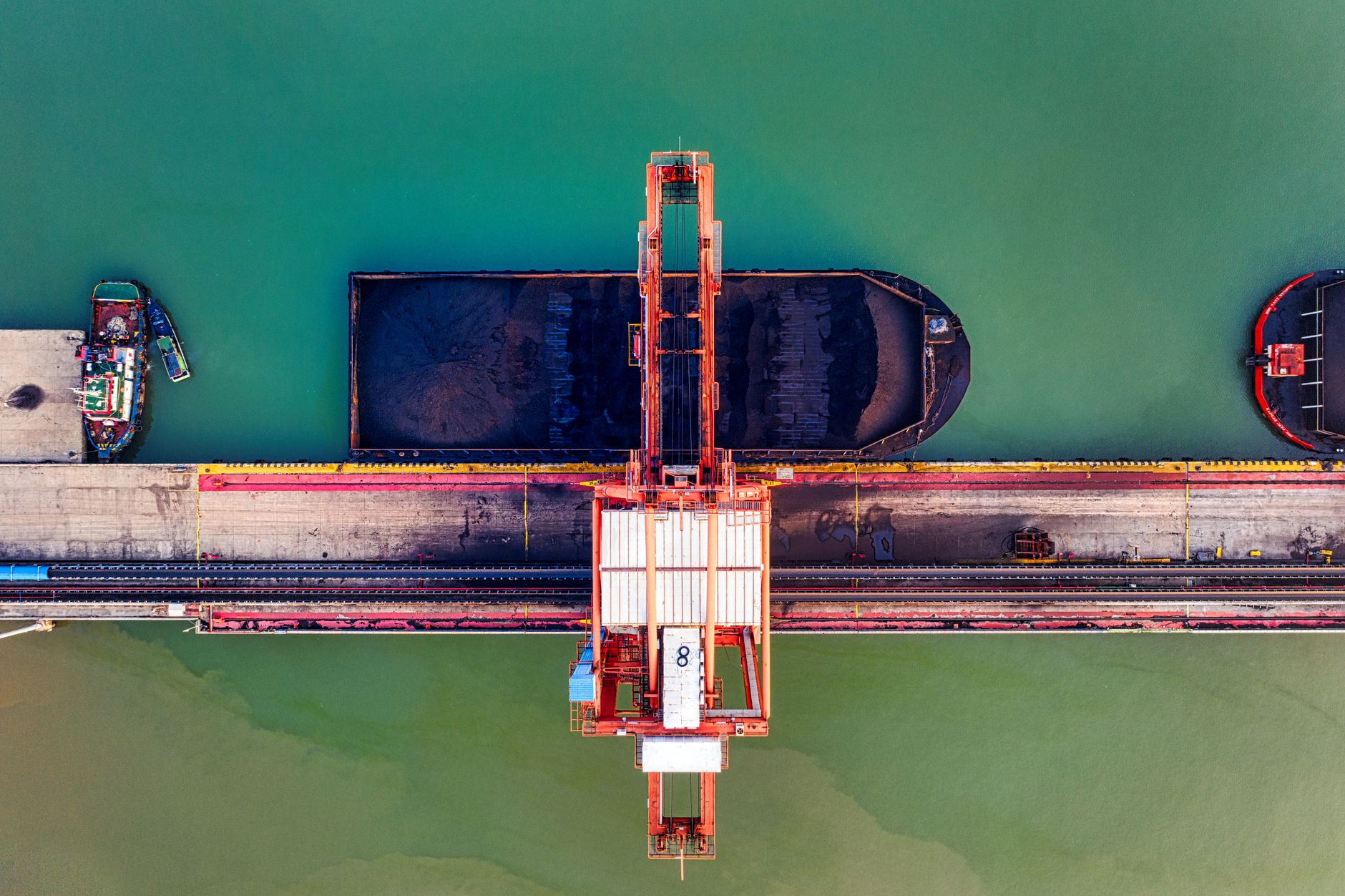 Aerial view of a cargo port in Banten, Indonesia, illustrating the export infrastructure Jakarta wants to control more tightly.