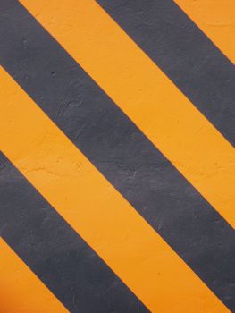 Close-up of a diagonal black and orange striped pattern, ideal for backgrounds.
