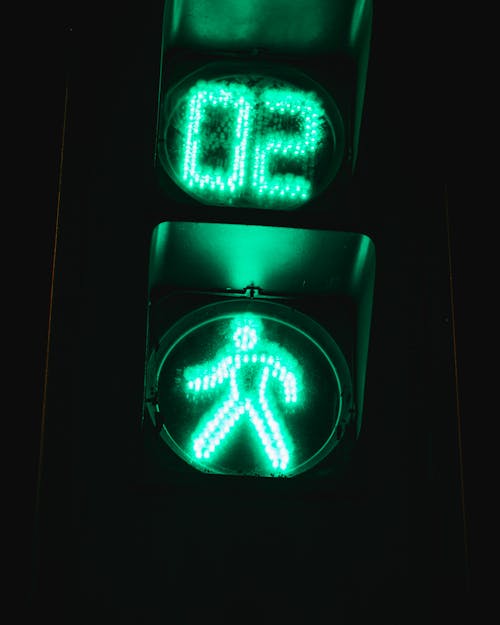 Green and White Stoplight Sign