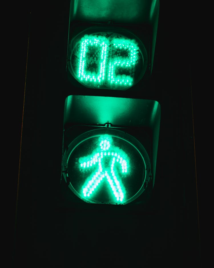 Green And White Stoplight Sign