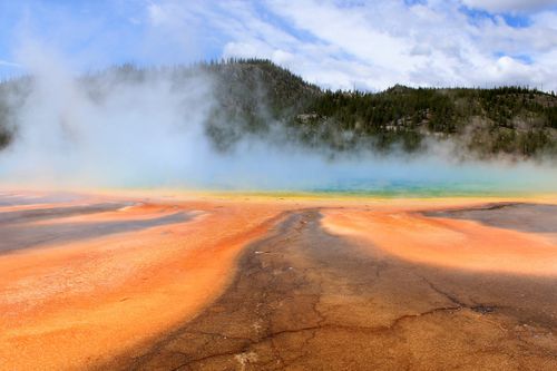 Free The vivid colors of Grand Prismatic Spring with rising steam in Yellowstone National Park. Stock Photo