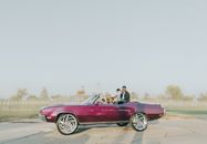Purple Convertible Coupe on Road