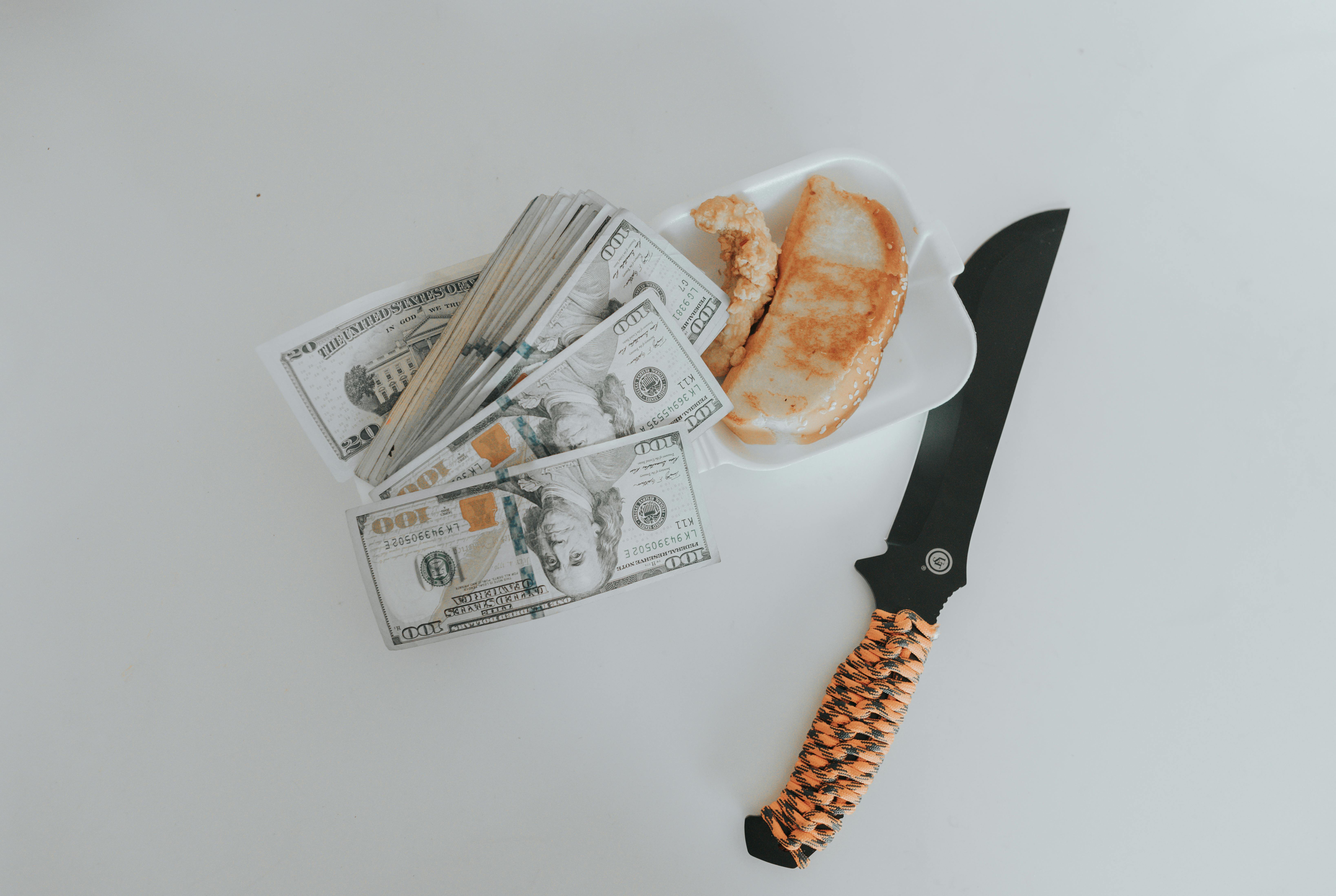 black handled knife on white ceramic plate