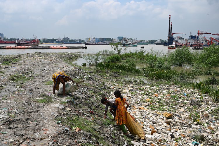 Garbage Collectors Picking Trash On The Street