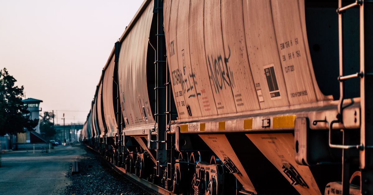 Freight Train Without Shell Freight train on empty railway station · Free Stock Photo