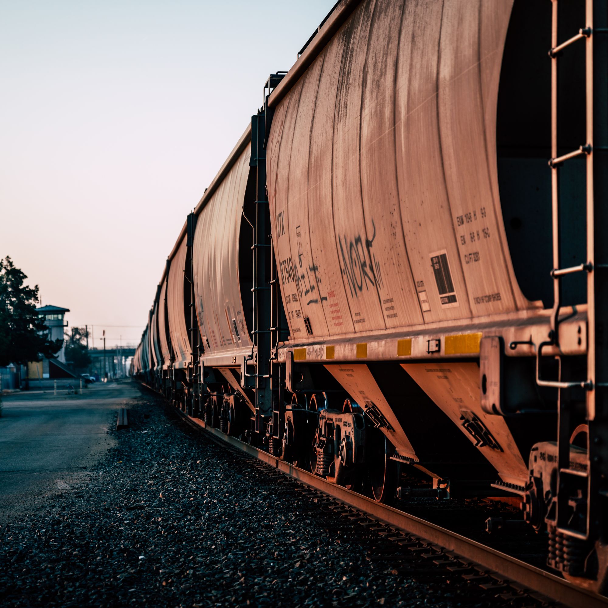 Freight train on an empty railway station track
