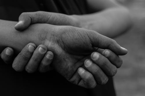 Close-up of Person Holding Hands