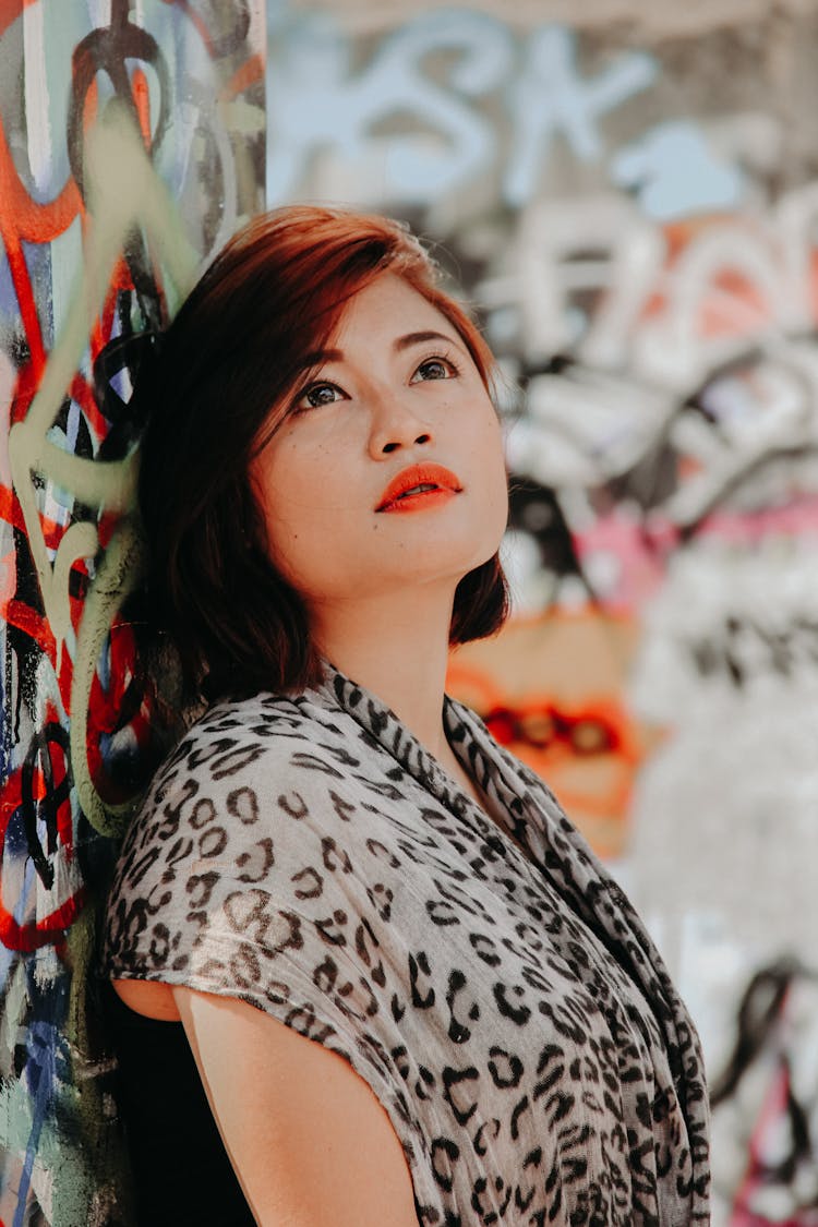 Woman In Leopard Print Scarf Looking Upwards