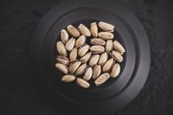 Brown Coffee Beans on Black Round Plate