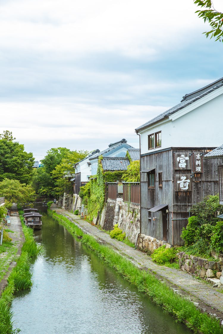 Old Houses Located On Canal Shore In Japan