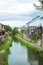 Canal flowing between small residential houses in town