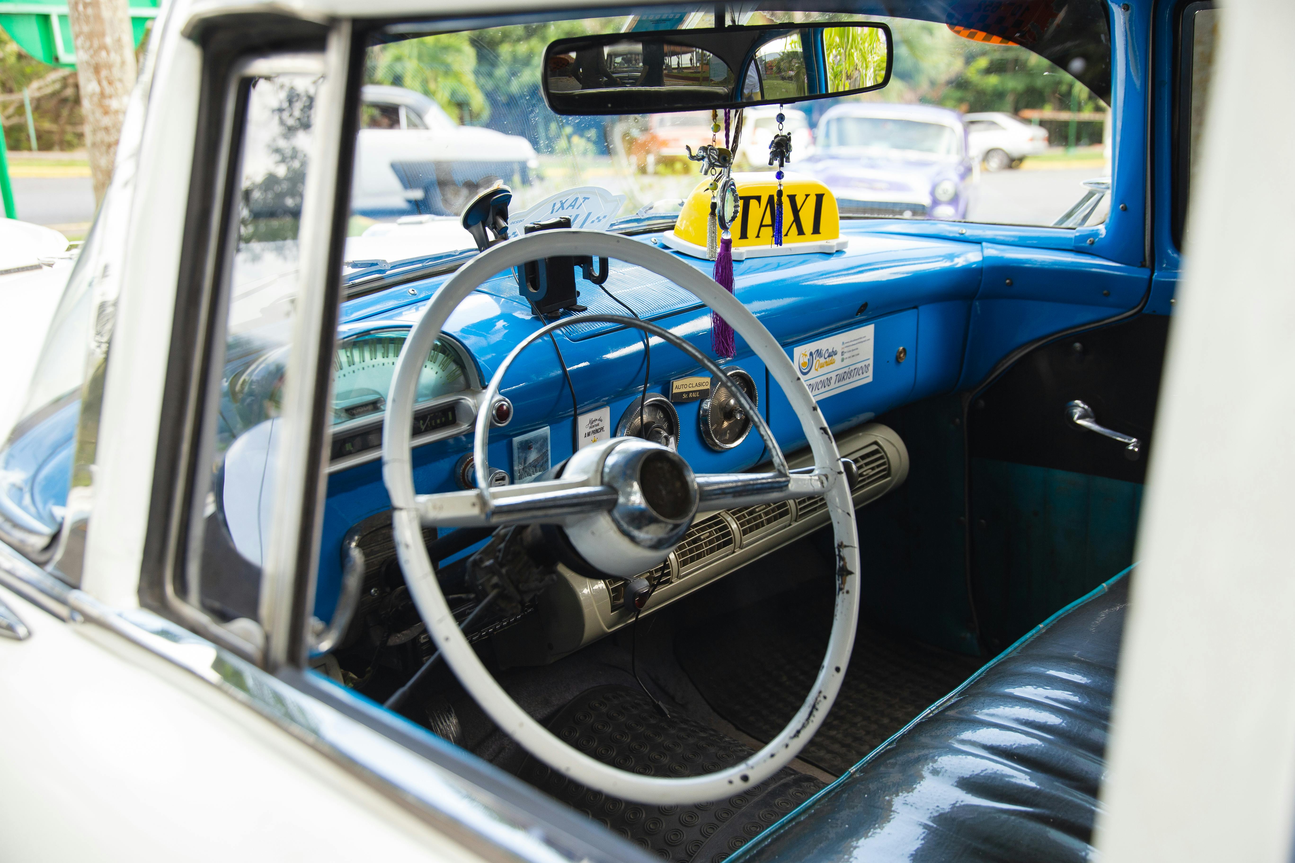 retro taxi vehicle parked on city street